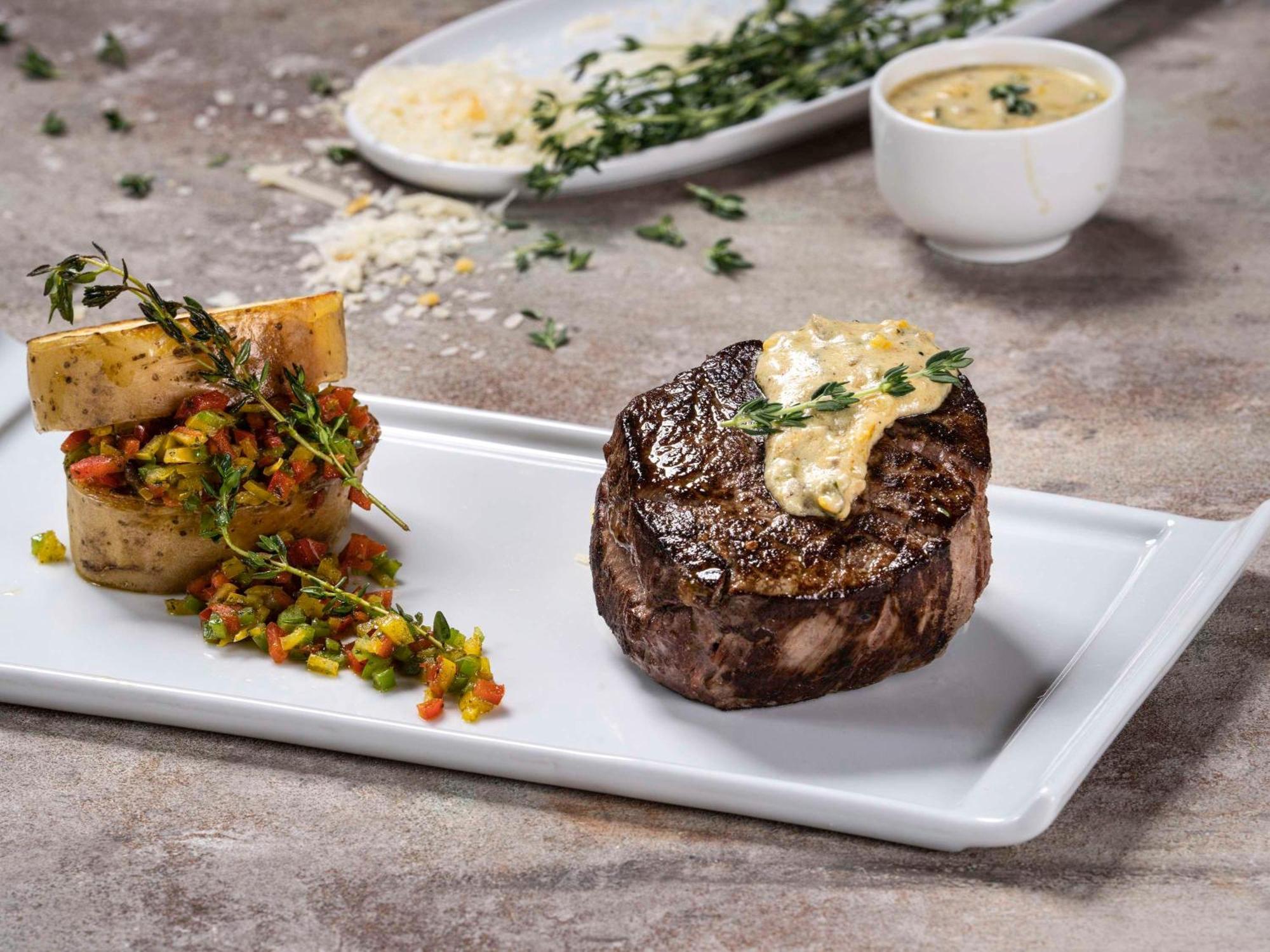 Movenpick Hotel And Residences 리야드 외부 사진 A steak prepared with a butter sauce